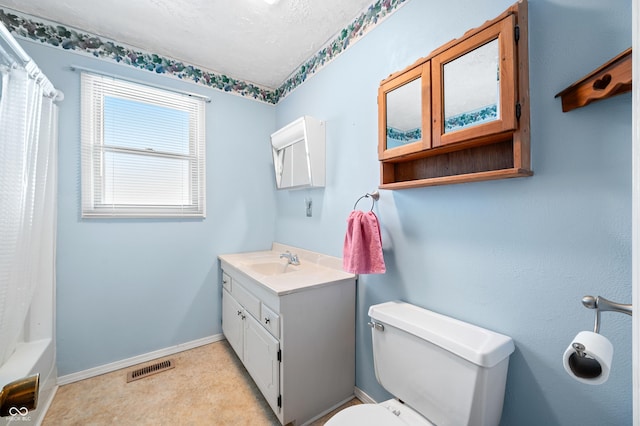 full bathroom with toilet, vanity, shower / tub combo with curtain, and a textured ceiling