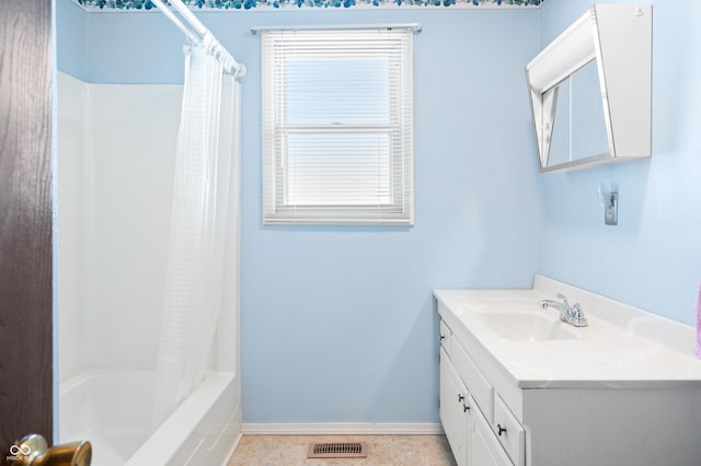 bathroom featuring vanity and shower / tub combo