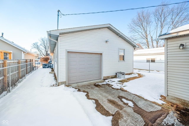 view of snow covered garage