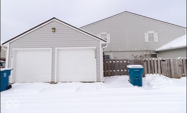 view of snow covered garage