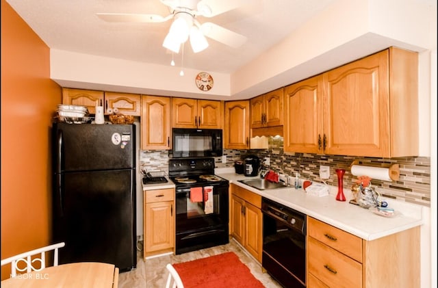 kitchen with decorative backsplash, sink, black appliances, and ceiling fan