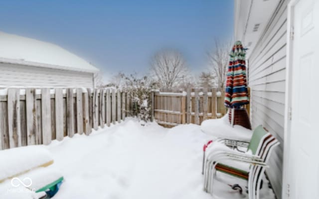 view of yard covered in snow