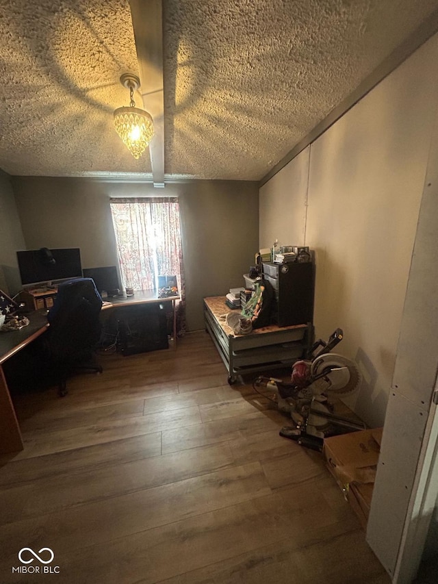 interior space with hardwood / wood-style flooring and a textured ceiling