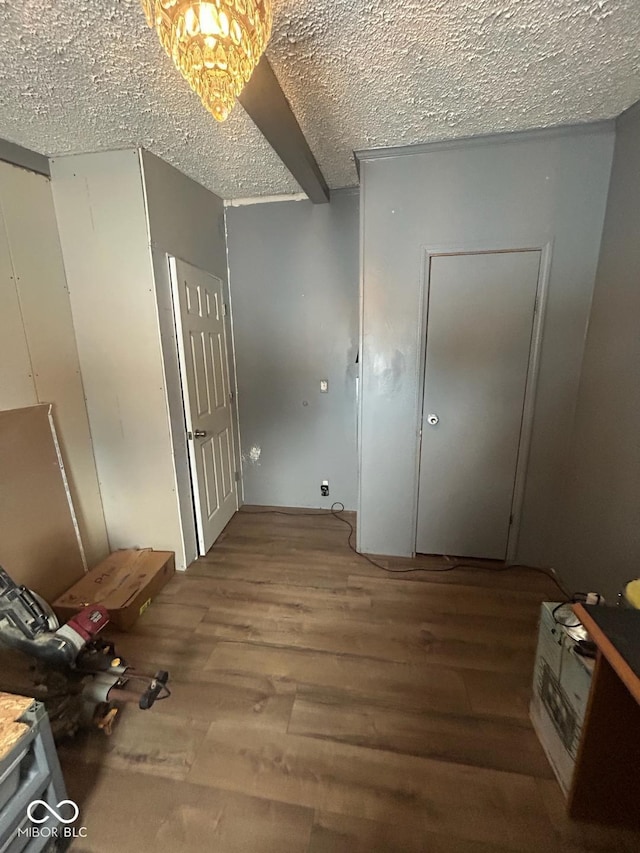 interior space with hardwood / wood-style flooring and a textured ceiling