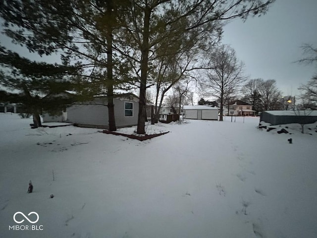 view of yard covered in snow