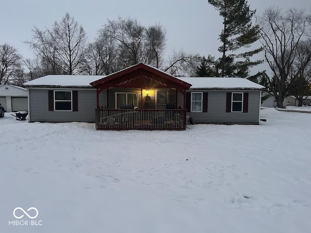 view of front of house featuring a porch and a garage