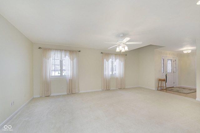 carpeted empty room with ceiling fan