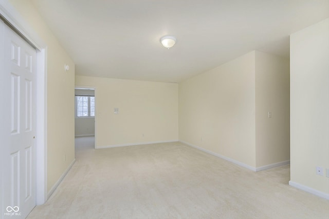 spare room with light colored carpet