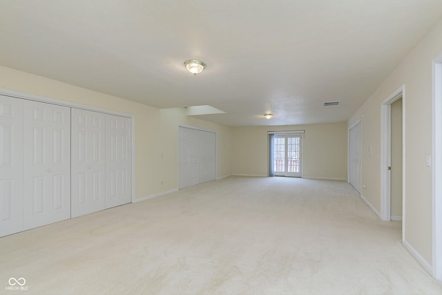 unfurnished bedroom featuring light colored carpet