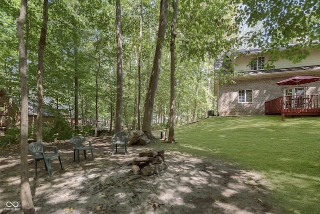 view of yard featuring a wooden deck