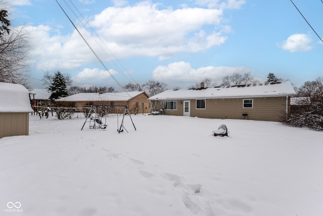 view of snow covered property