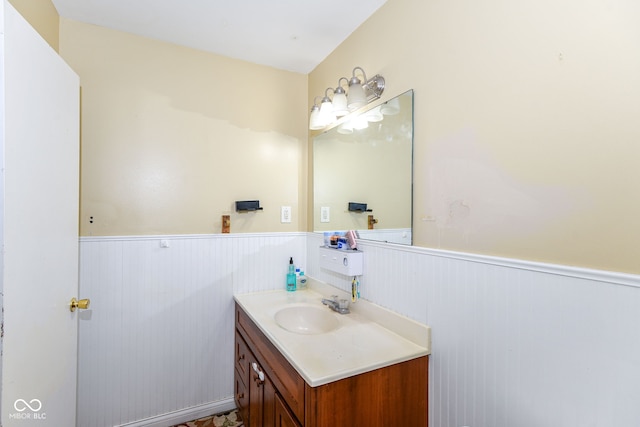 bathroom with wooden walls and vanity