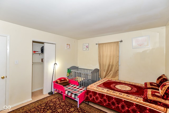 bedroom with a closet and carpet flooring