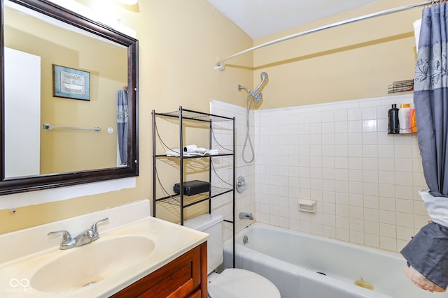 full bathroom with toilet, vanity, and shower / tub combo