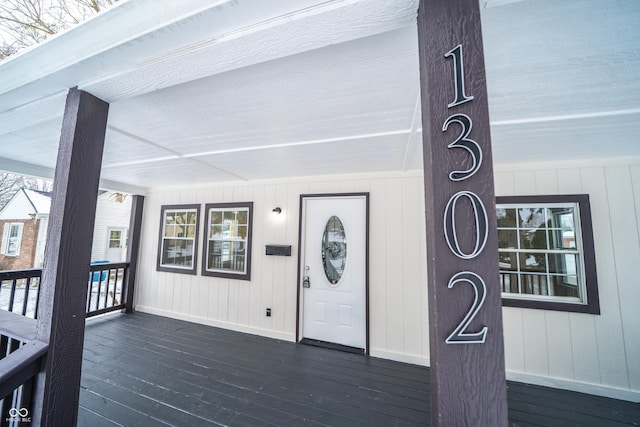 view of exterior entry with covered porch