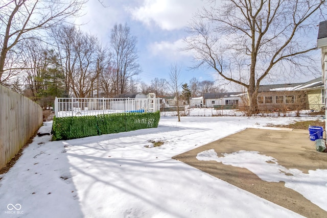 view of yard layered in snow