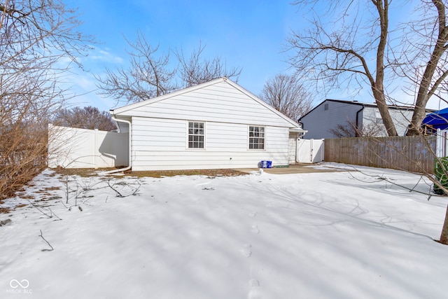 view of snow covered house