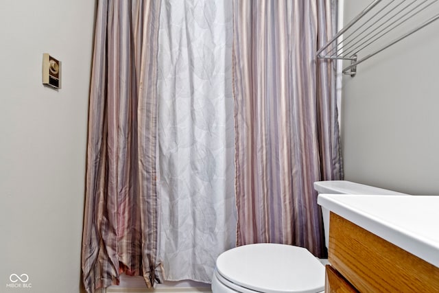 bathroom with toilet and vanity