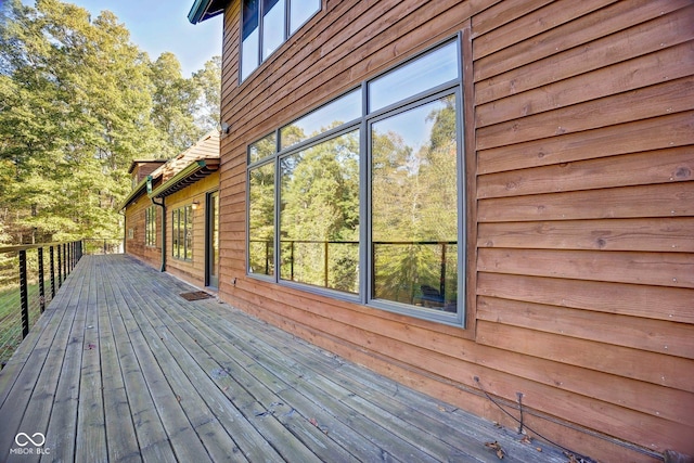 view of side of home with a deck