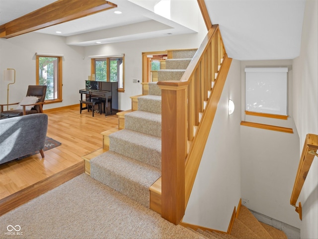 staircase featuring hardwood / wood-style floors