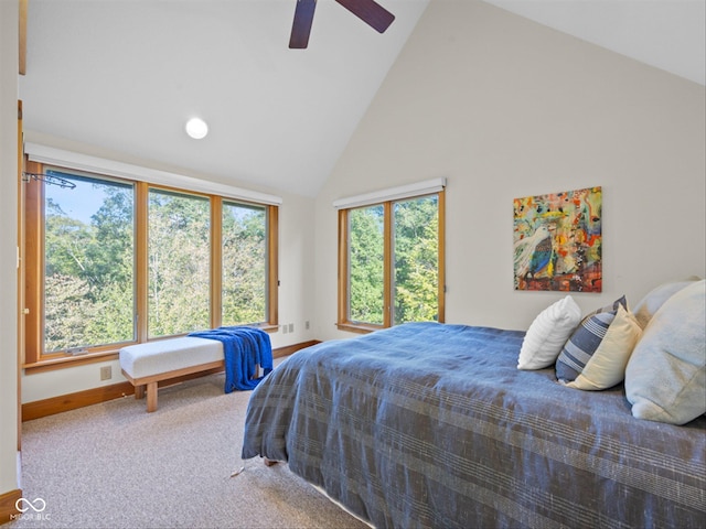 carpeted bedroom with high vaulted ceiling and ceiling fan