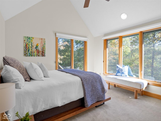 carpeted bedroom with ceiling fan and lofted ceiling