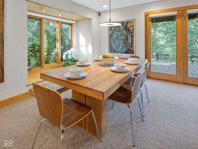 view of carpeted dining space