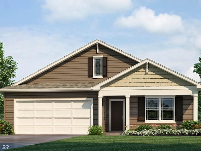 view of front of property featuring a garage and a front yard