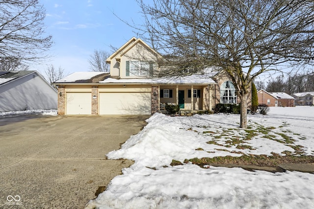 front of property featuring a garage and covered porch