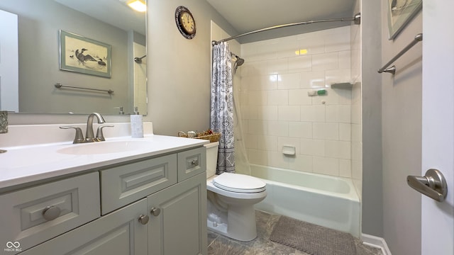 full bathroom with vanity, shower / bath combo with shower curtain, and toilet