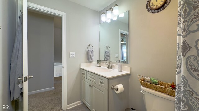 bathroom with vanity and toilet