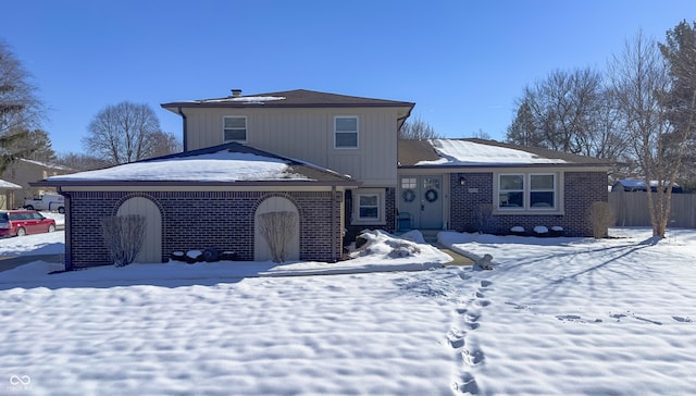 view of snow covered house