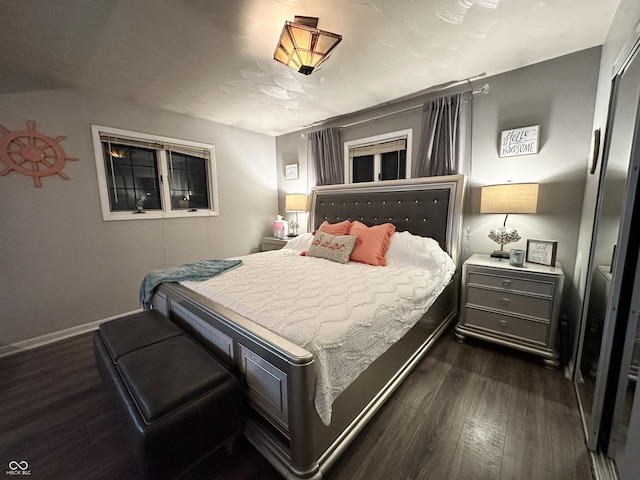 bedroom featuring dark hardwood / wood-style flooring