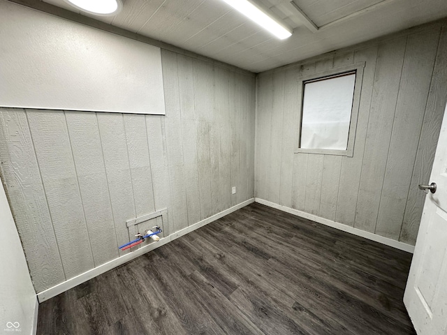 spare room with dark hardwood / wood-style floors