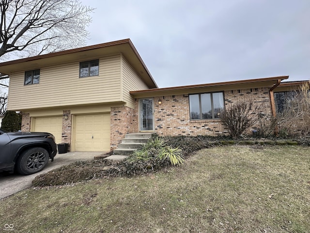 split level home featuring a garage and a front yard