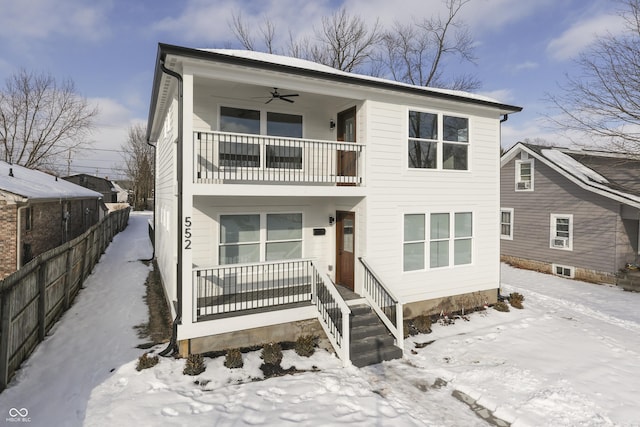 view of front of home featuring ceiling fan, a balcony, and covered porch