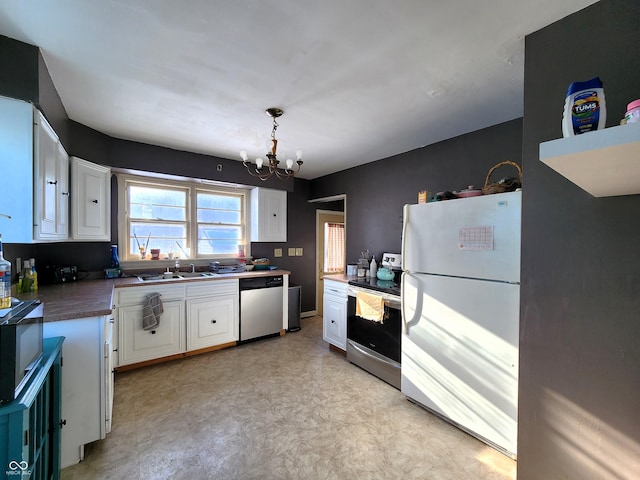 kitchen with a sink, an inviting chandelier, white cabinets, and stainless steel appliances