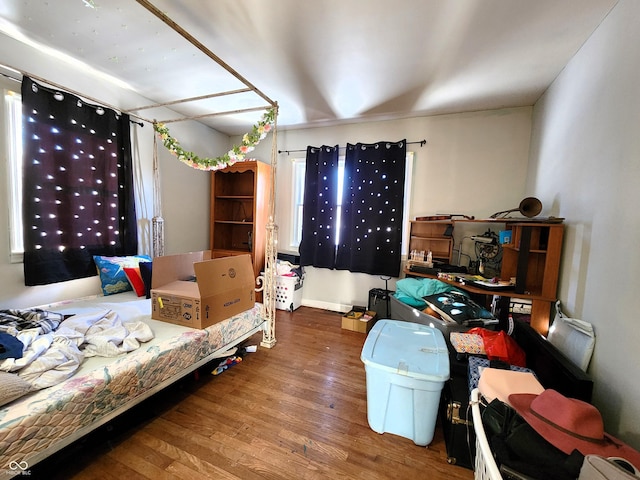 bedroom with wood finished floors