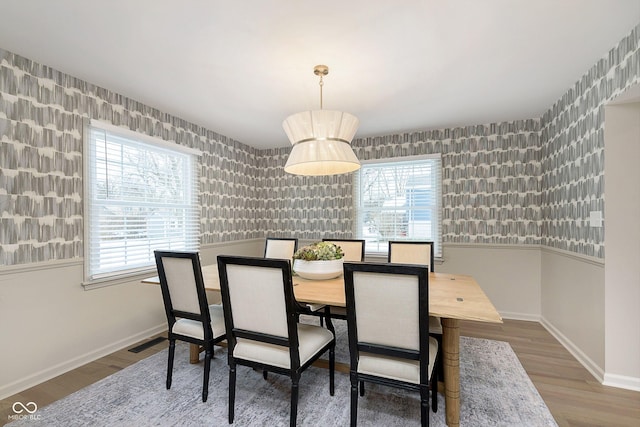 dining room with wood-type flooring