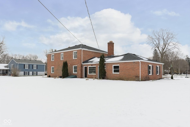 view of snow covered house