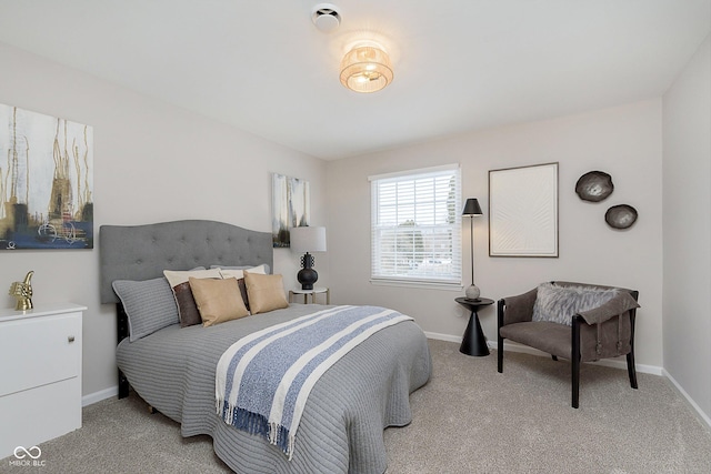 bedroom with light colored carpet