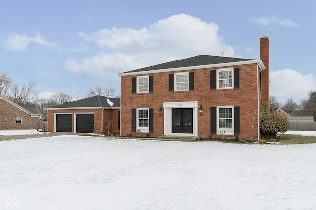 colonial home featuring a garage