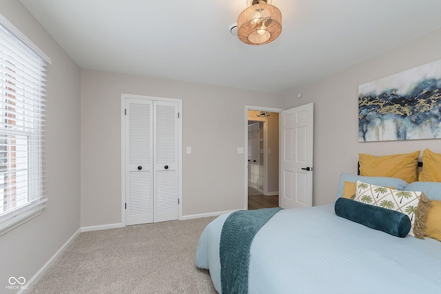 carpeted bedroom featuring a closet