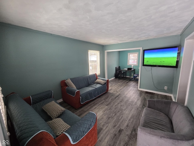 living room featuring a textured ceiling and dark hardwood / wood-style floors