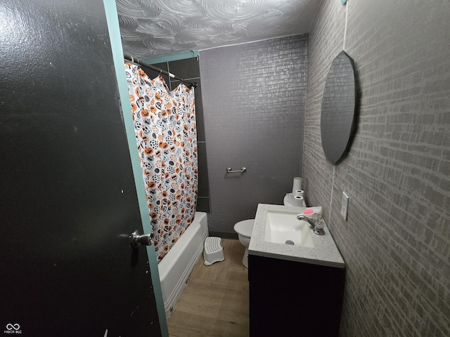 full bathroom featuring toilet, vanity, shower / tub combo, and hardwood / wood-style floors