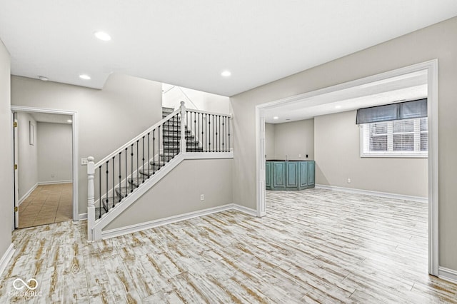 basement featuring light hardwood / wood-style floors