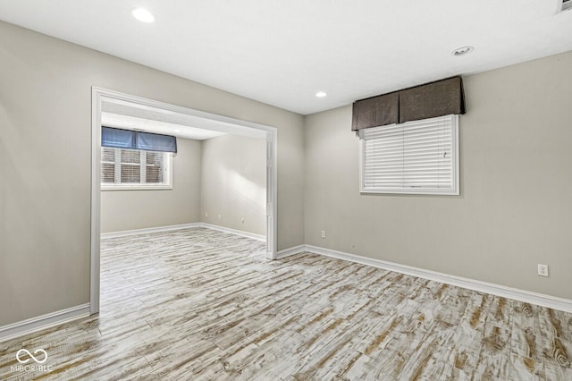 empty room with light hardwood / wood-style floors