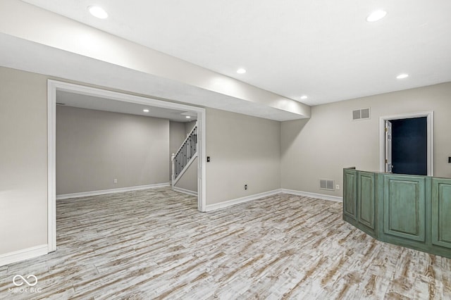 basement featuring light hardwood / wood-style floors