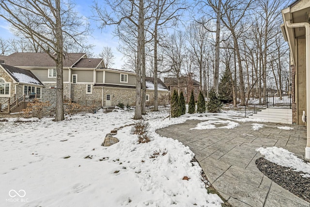 view of yard layered in snow