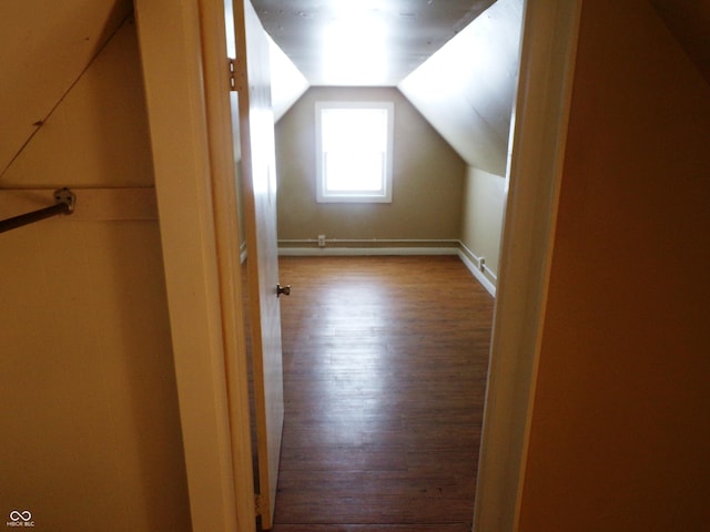 additional living space with lofted ceiling and light hardwood / wood-style floors